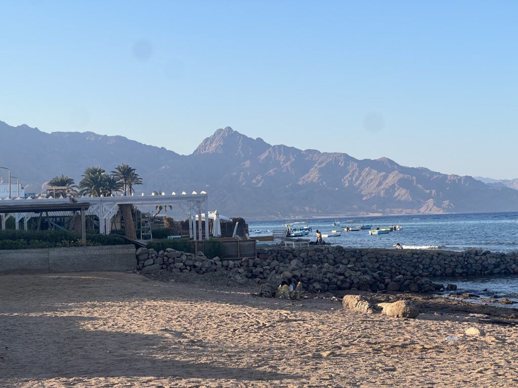view of beach in Dahab with mountains in the background