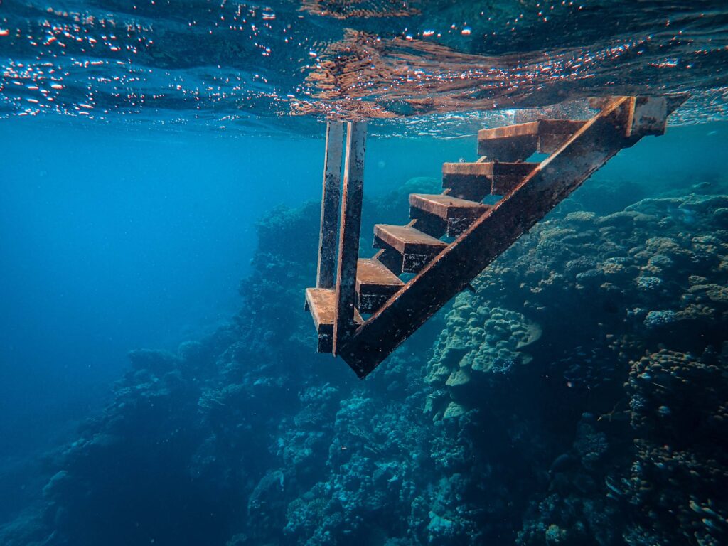 stairs leading into the ocean in Dahab Egypt