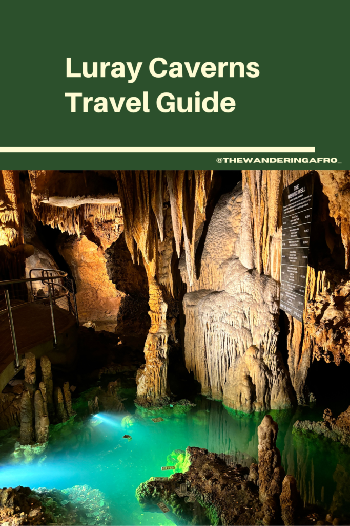 image of luray caverns with small pool of water at the bottom, surrounded by rocks