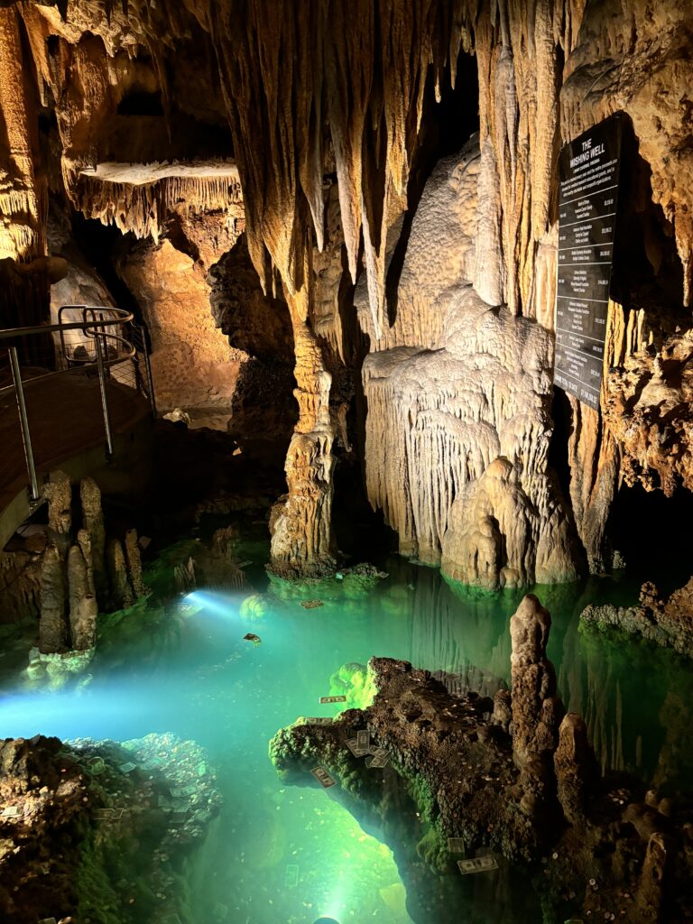 showcases Luray caverns with pool of water at bottom