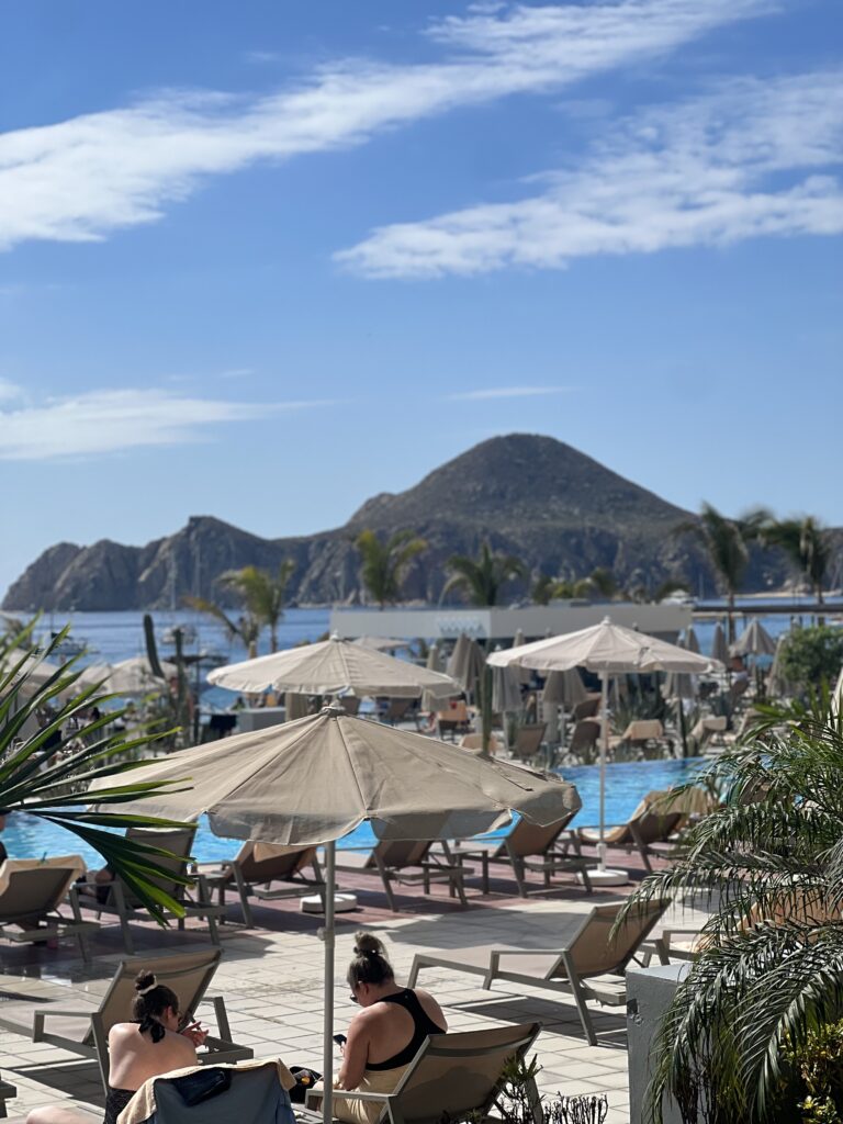 resort in Cabo San Lucas , shows the pool and mountains in the baackground