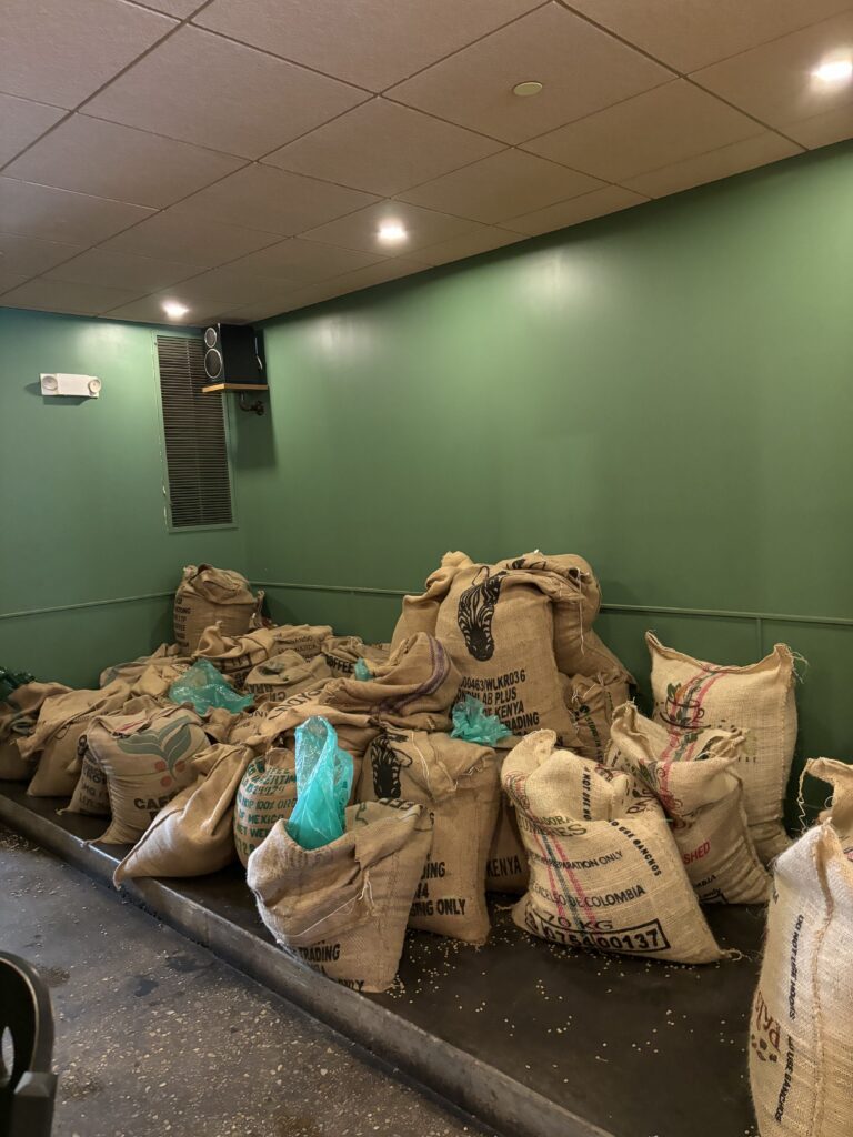 burlap bags of coffee beans stored in coffee shop