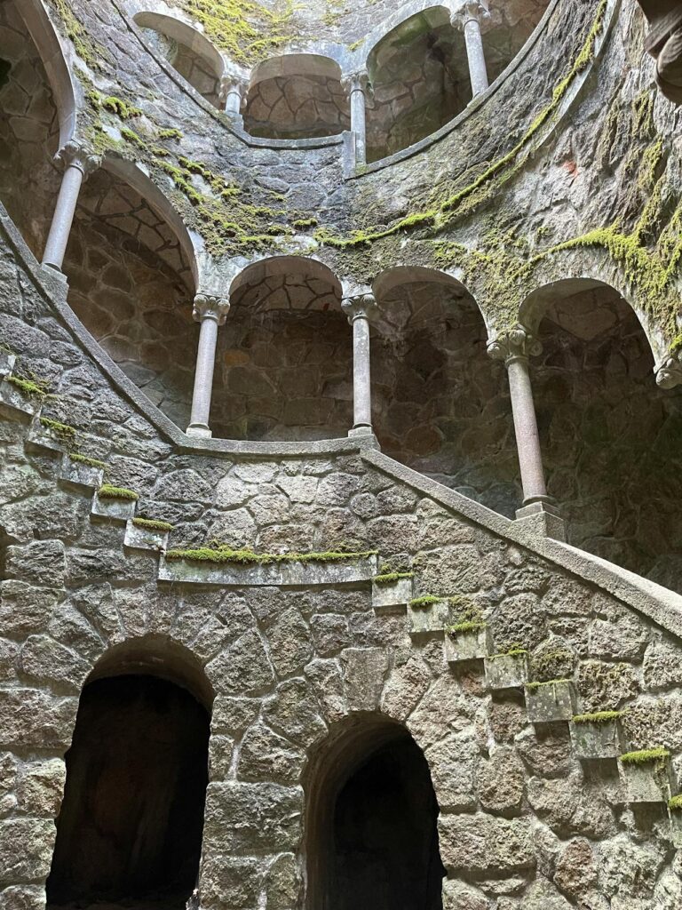 The spiral stairs at the Initiation Well at Quinta da Regaleira shows a light at the top