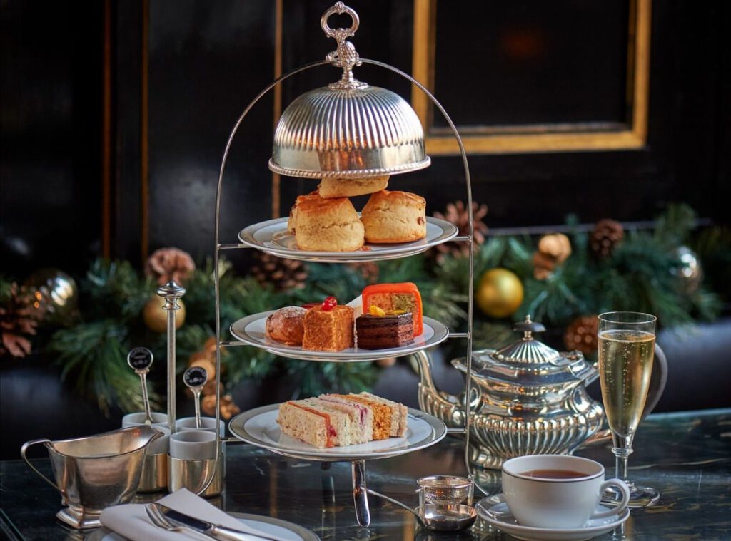 3 tier silver afternoon tea tray with scones, pastries, and tea sandwiches
