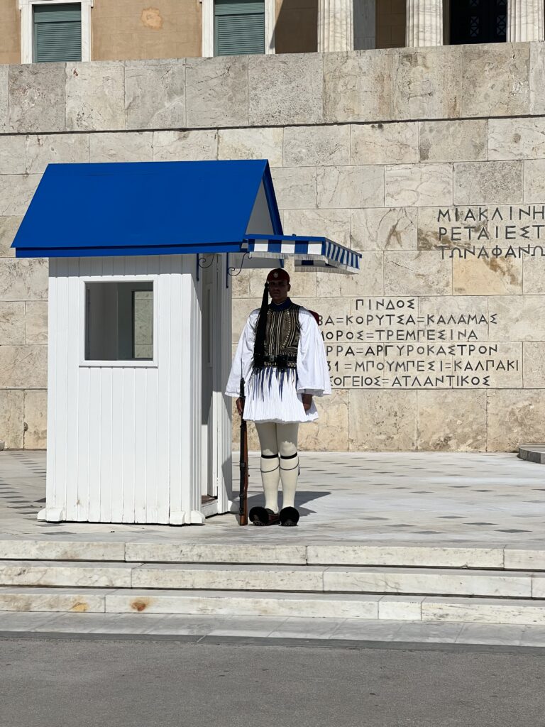 Guard in Athens stand at his post in traditional guard attire