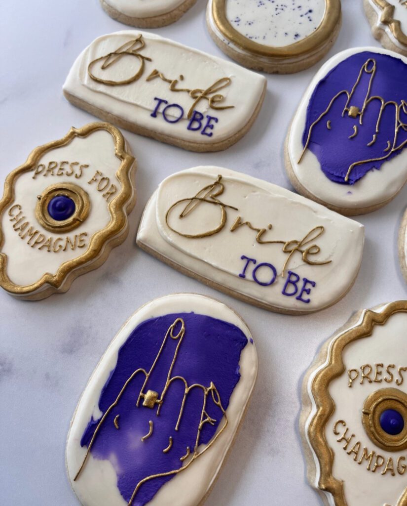cookies of different shapes. A few say "bride to  be" and show a woman's ring finger